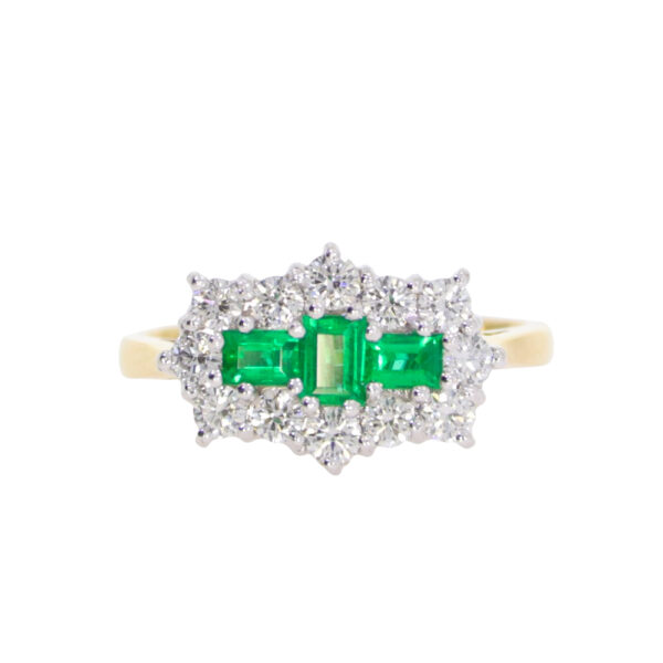 Emerald and diamond baguette and brilliant cut cluster ring, 18ct gold mount