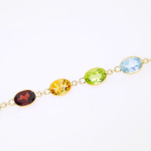 SP:B525P-Y Multi gem and 18ct gold bracelet close up