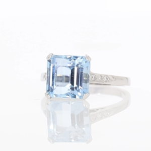 Aquamarine single stone ring, with diamond set shoulders, platinum and 18ct white gold mount video