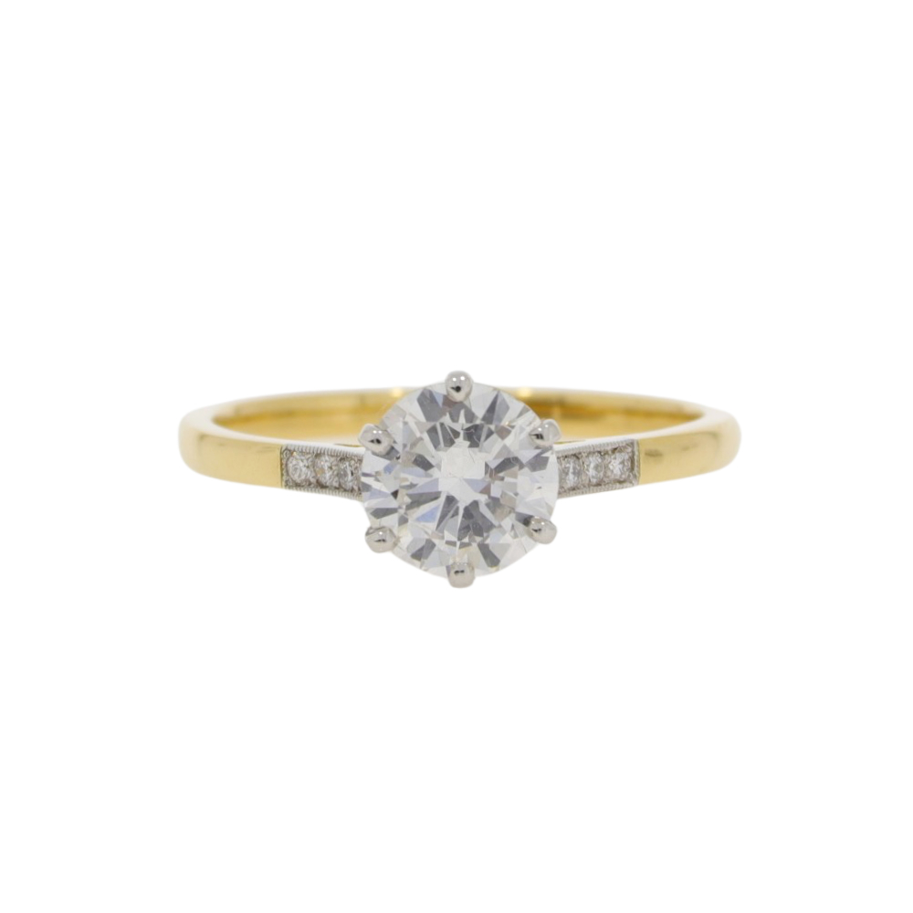 Diamond single stone ring, diamond set shoulders, platinum and 18ct gold yellow mount