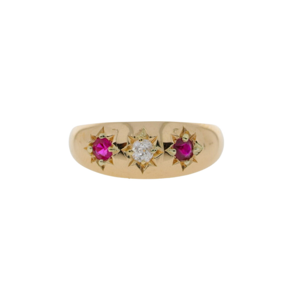 Ruby and diamond three stone star set ring, 18ct yellow gold mount