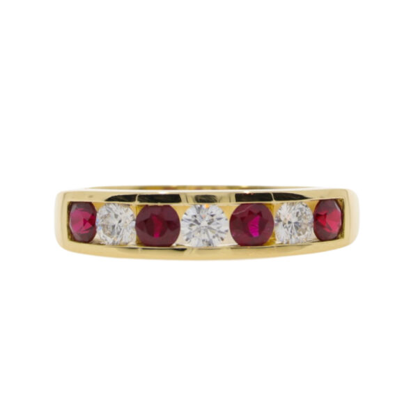 Ruby and diamond seven stone half eternity ring, 18ct gold channel set mount