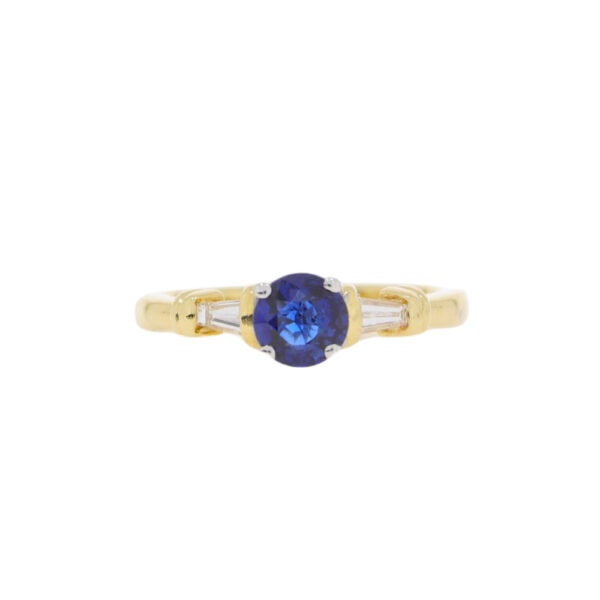 Sapphire single stone ring with tapered baguette cut diamond shoulders, 18ct gold mount