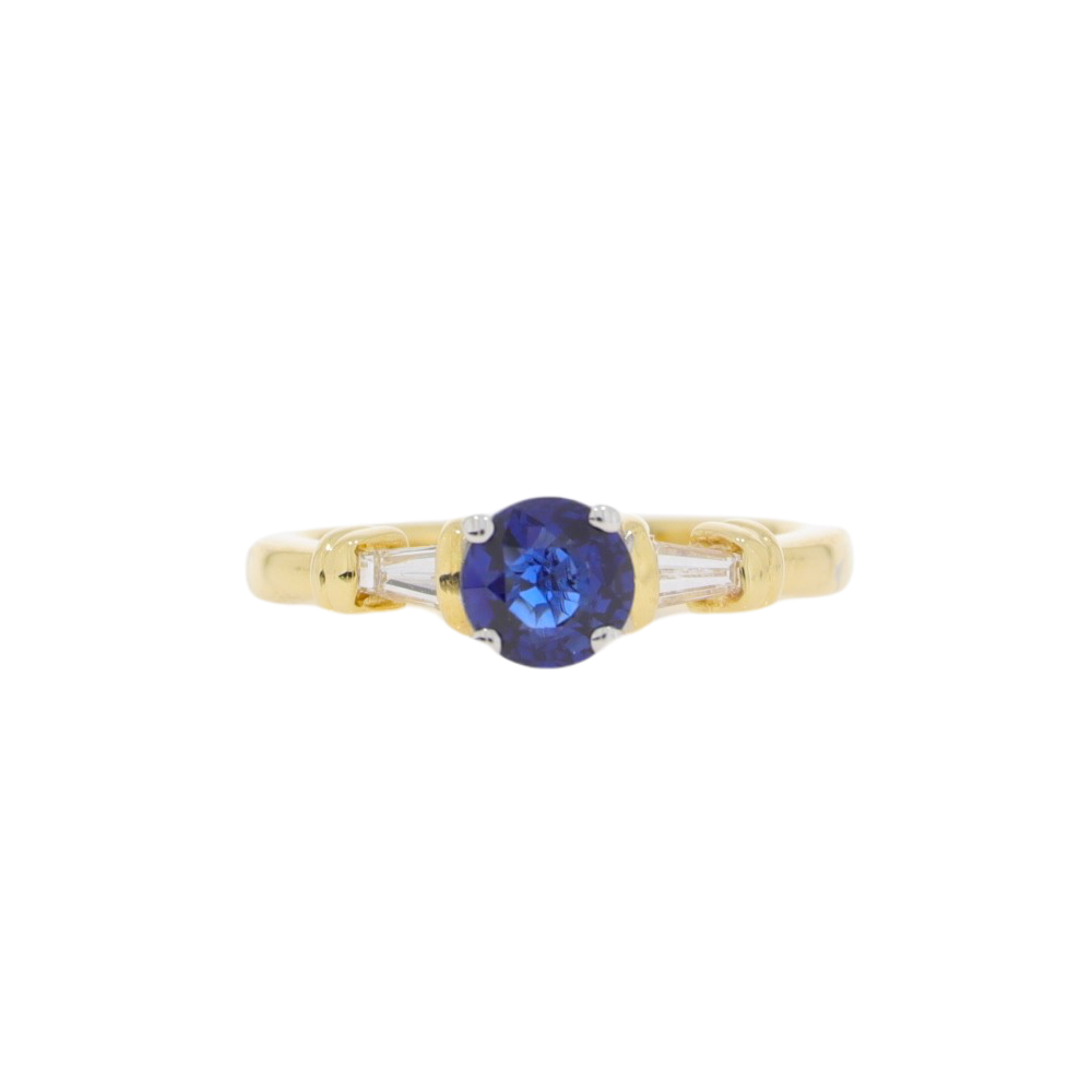 Sapphire single stone ring with tapered baguette cut diamond shoulders, 18ct gold mount