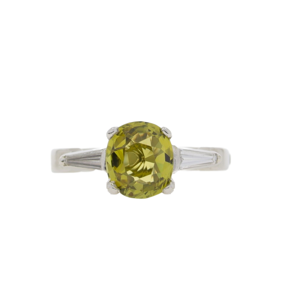 Chrysoberyl single stone ring with diamond tapered baguette cut shoulders, platinum mount