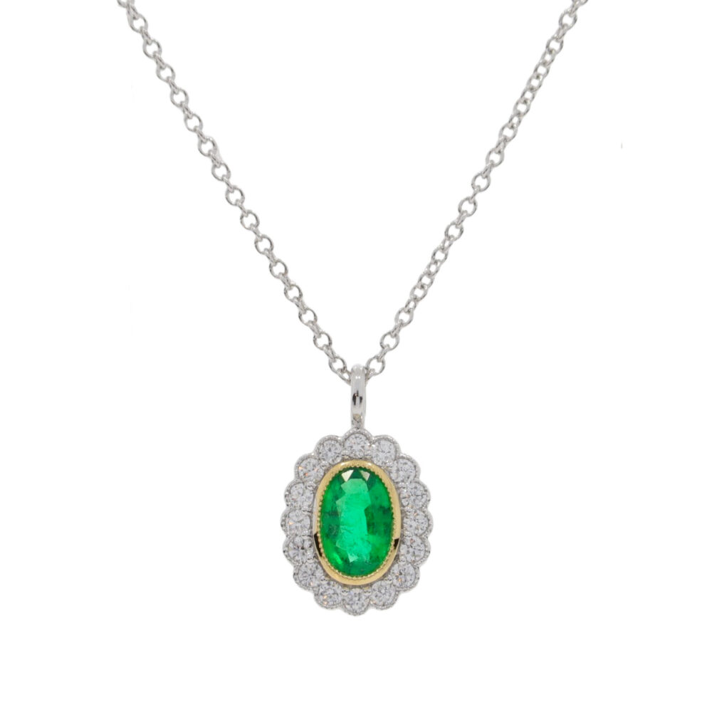 Emerald and diamond millegrain oval cluster pendant, 18ct white gold mount and necklet