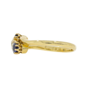 T113.4 Sapphire and diamond 3 stone crossover ring end
