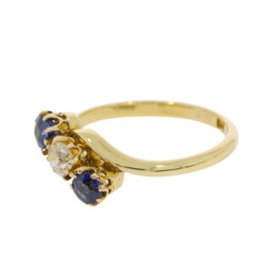 T113.4 Sapphire and diamond 3 stone crossover ring. side 2jpg
