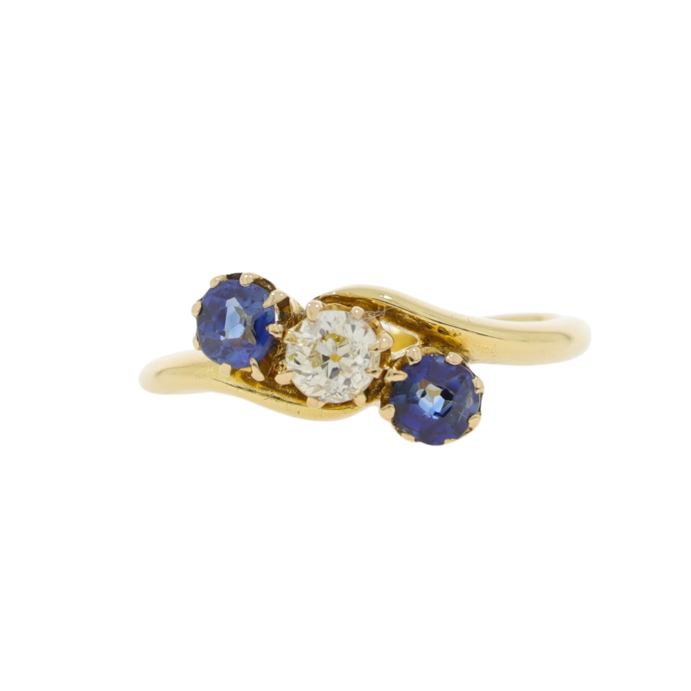 Sapphire and diamond three stone crossover ring, 18ct gold mount