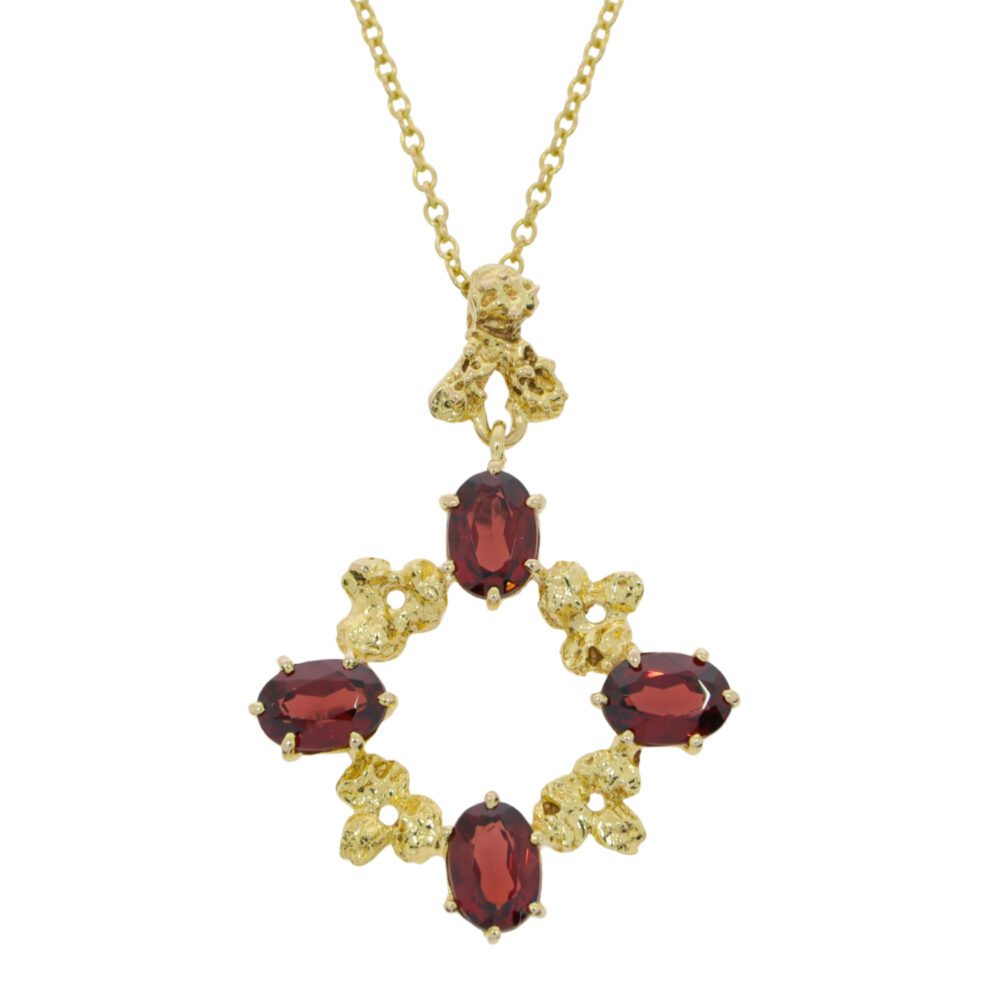 Garnet and leaf open pendant, 9ct yellow gold mount and necklace
